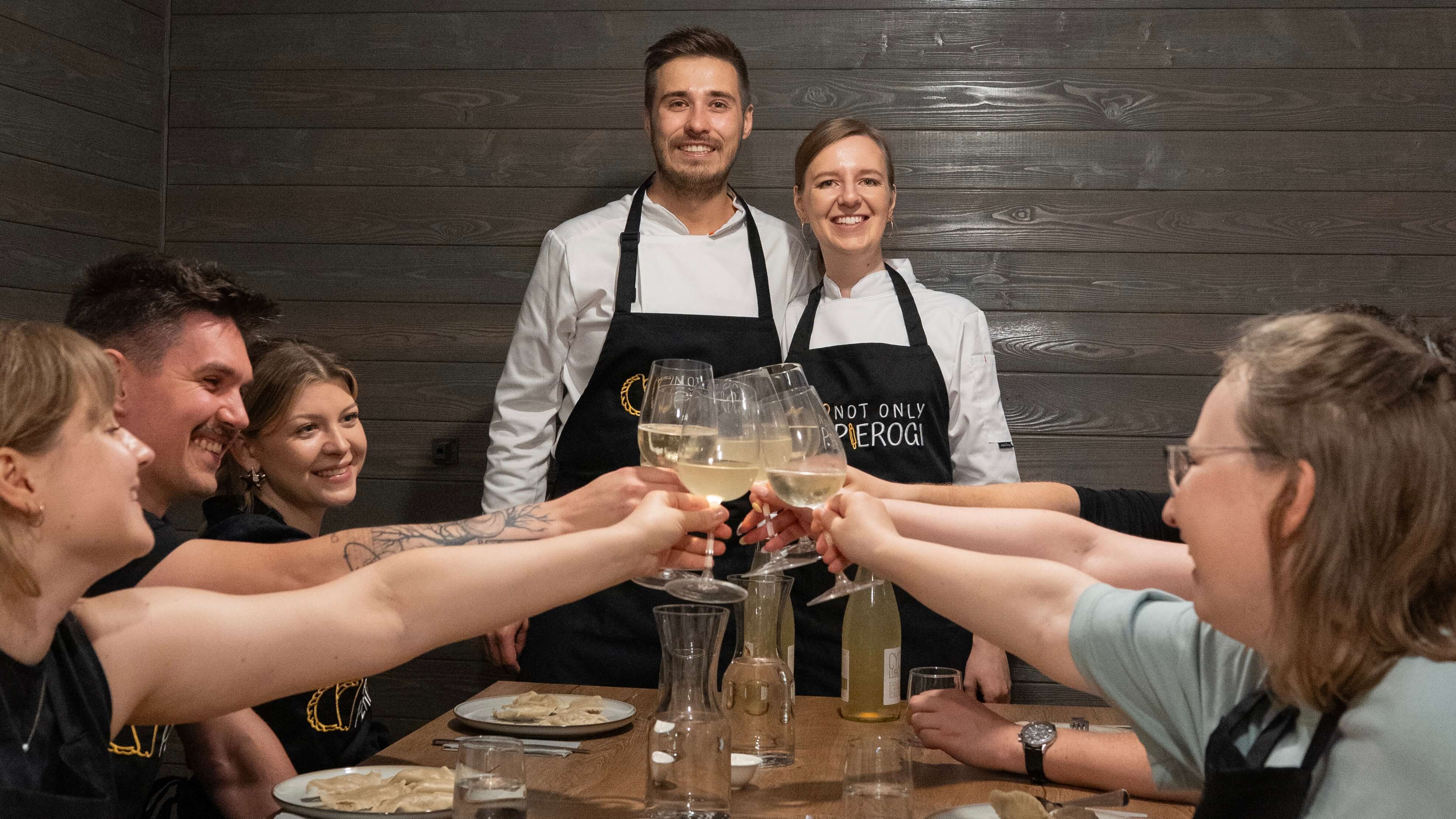 Raising toast with local cider during Pierogi Cooking Class in Warsaw